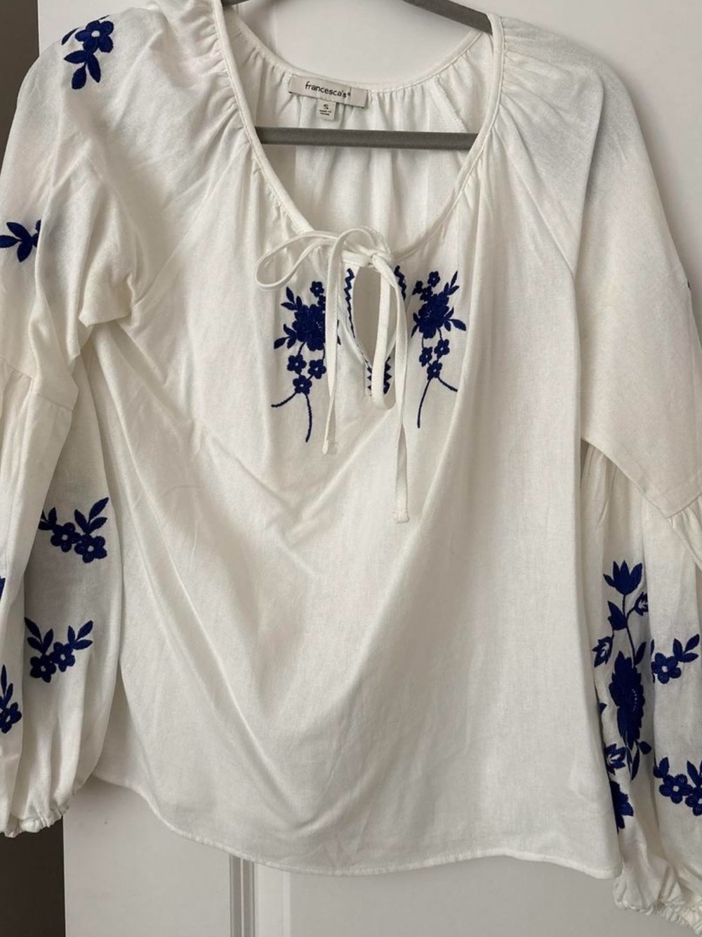 Francesca's White Peasant Top with Navy Blue Floral Embroidery